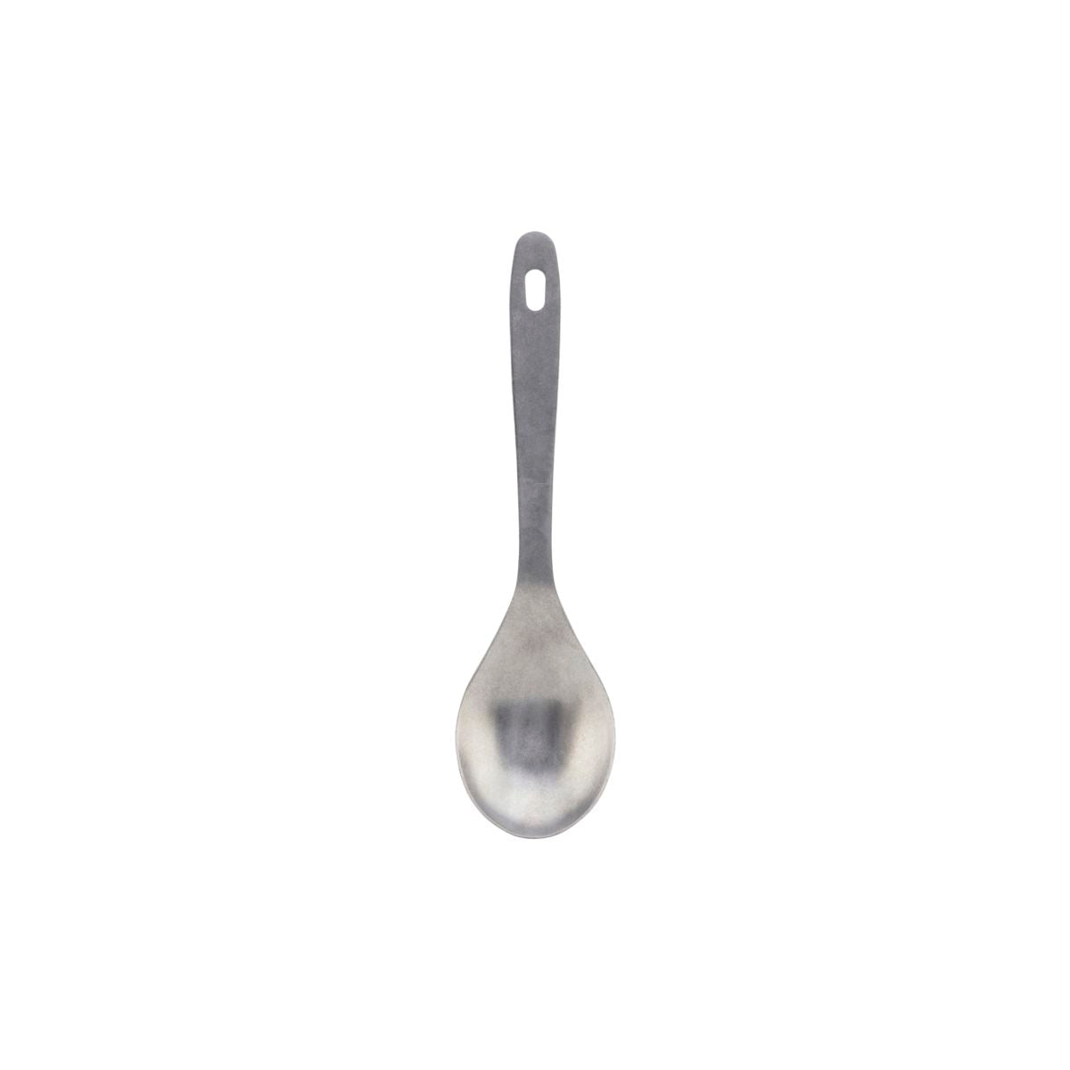 A stainless steel serving spoon, rounded with a long handle and a hole in the end of the handle to hang up the spoon on a hook.
