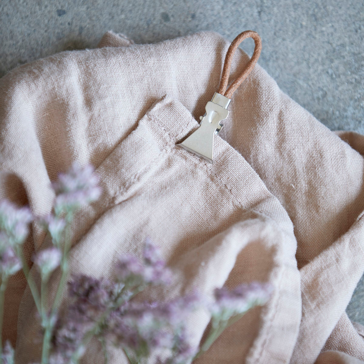 Leather loops with silver metal clips attached.