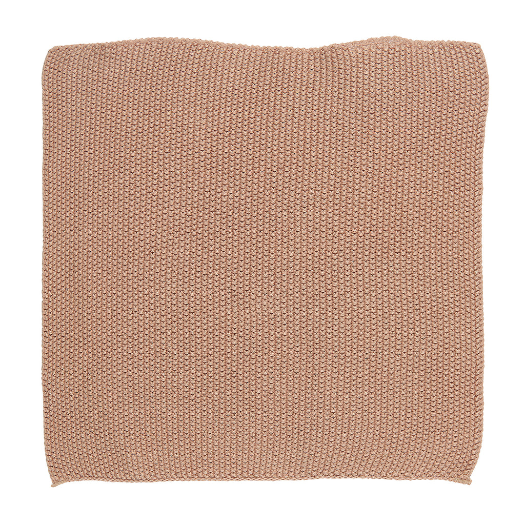 A square knitted cloth in a soft faded rose pink colour.