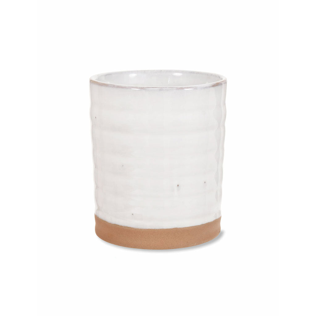 Small ceramic pot part glazed in off-white, with the base in a sandy coloured ceramic. 