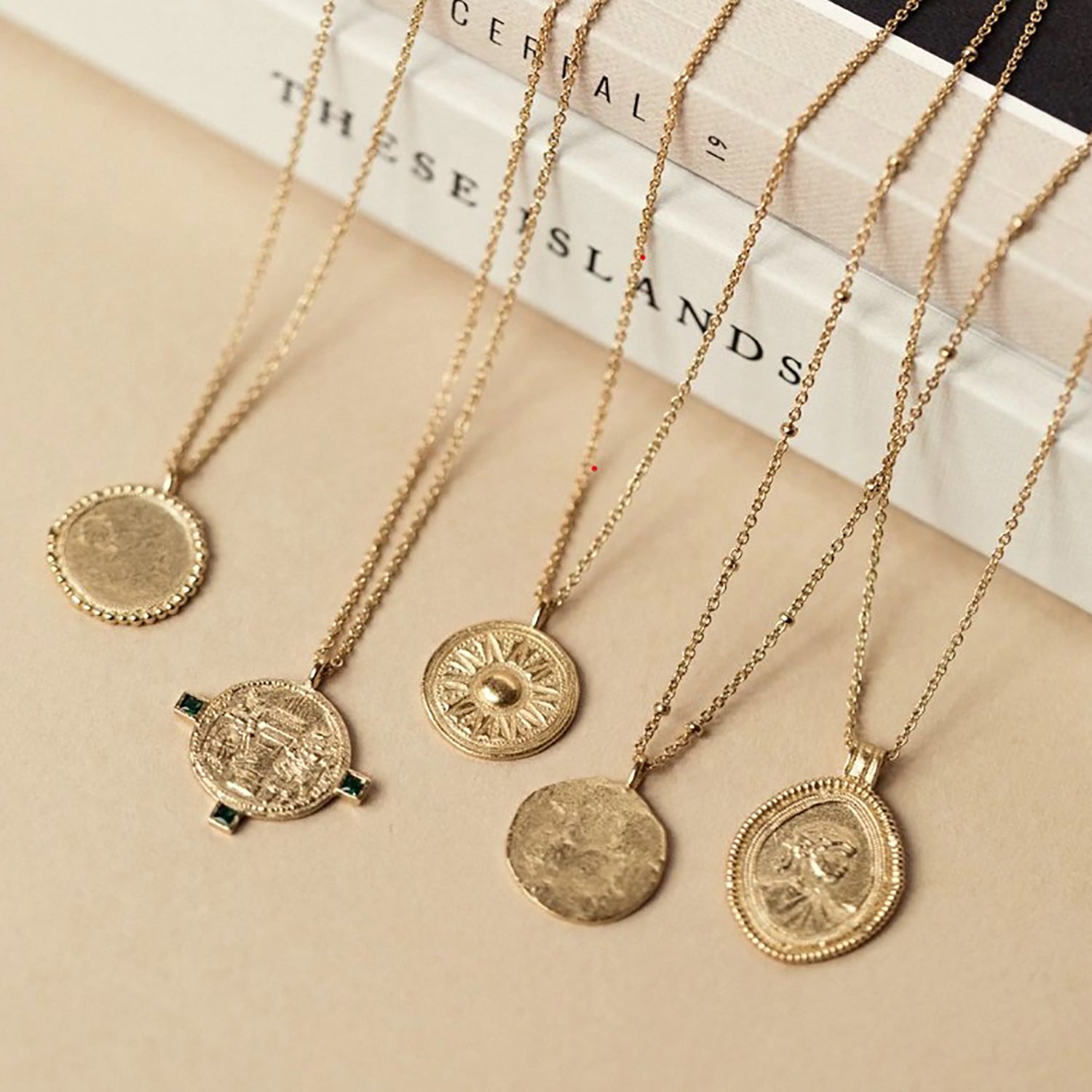 Religious gold coin necklace on sale