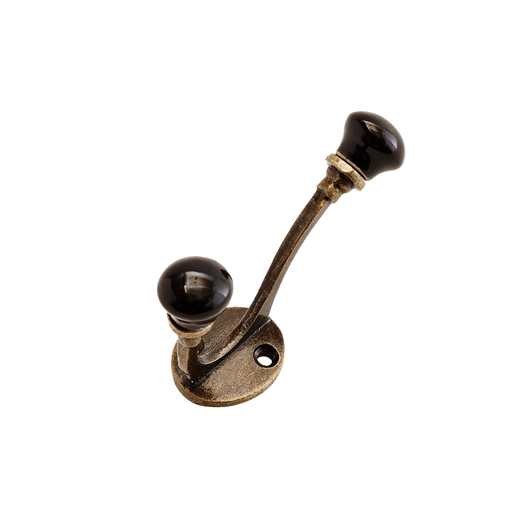 Double hook in brass with black ceramic ends. Madam Stoltz.